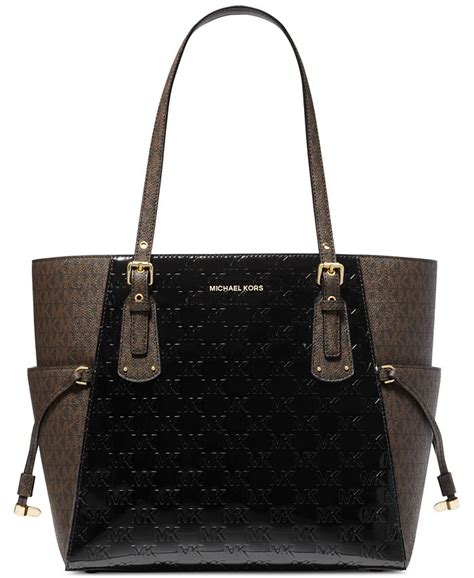 michael kors monogram east west tote|Michael Kors large tote bag.